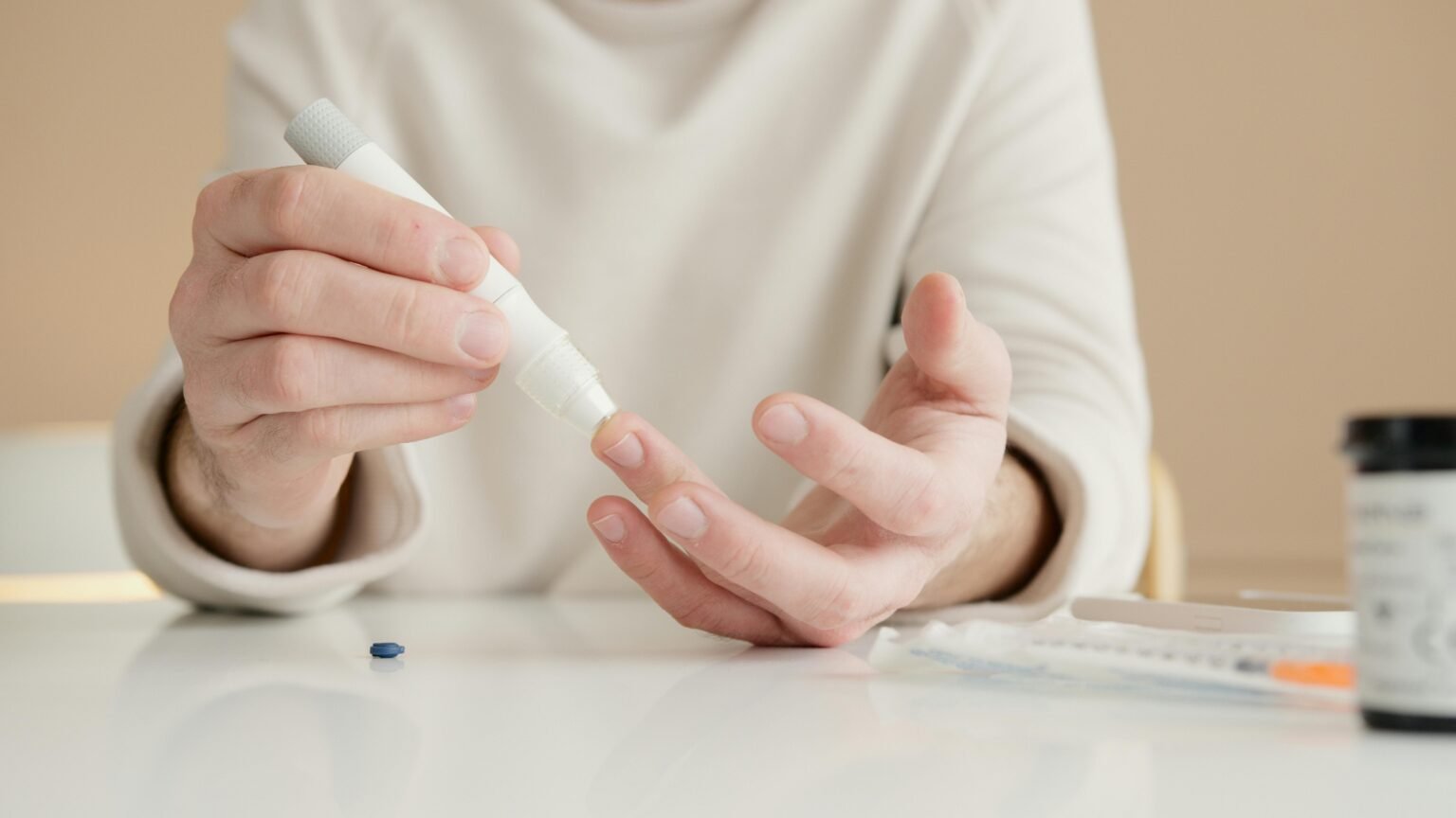 Women taking blood sample for testing - How to control Blood Sugar Level.